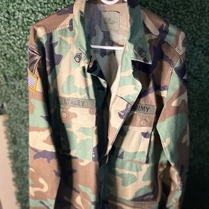 Mid army surplus jacket with patches and name tag